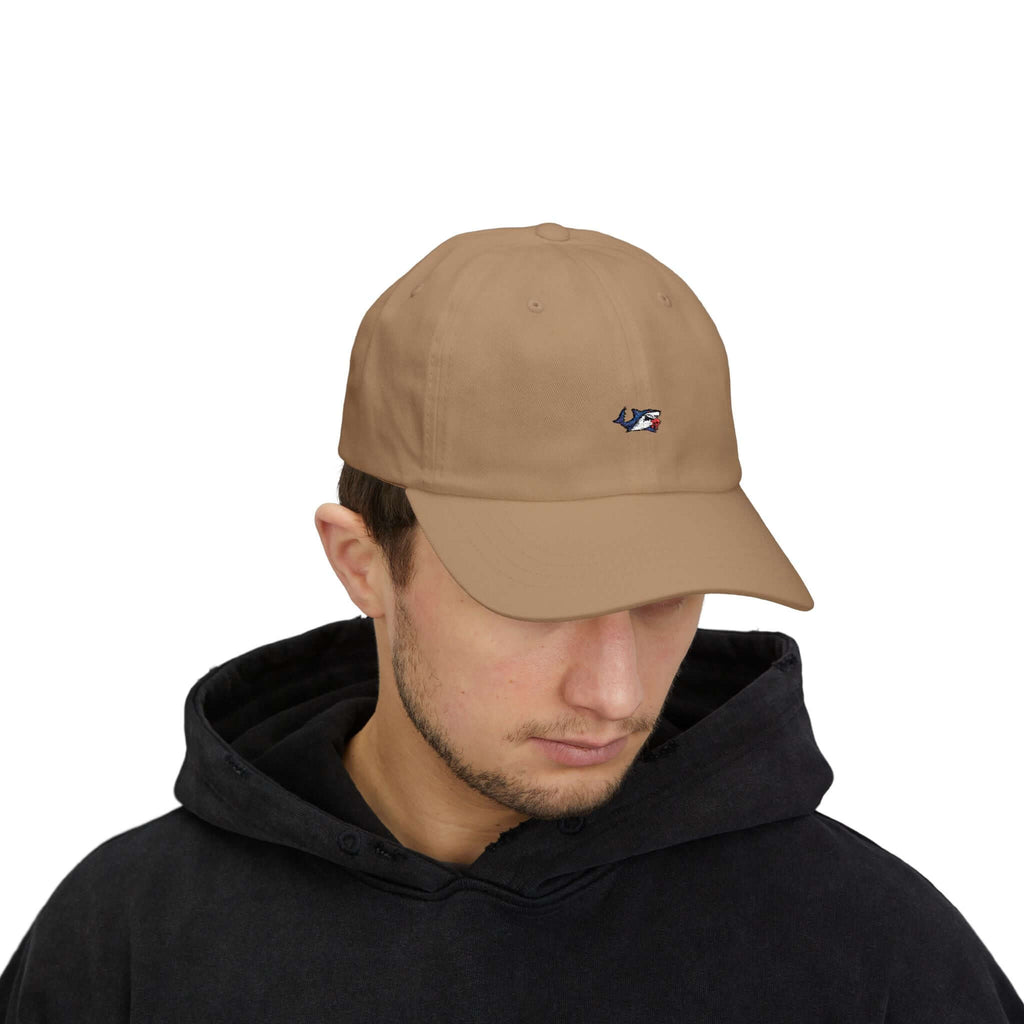 Man wearing beige TeamSharkcage classic cap, front view showcasing embroidered logo, styled for everyday casual wear.