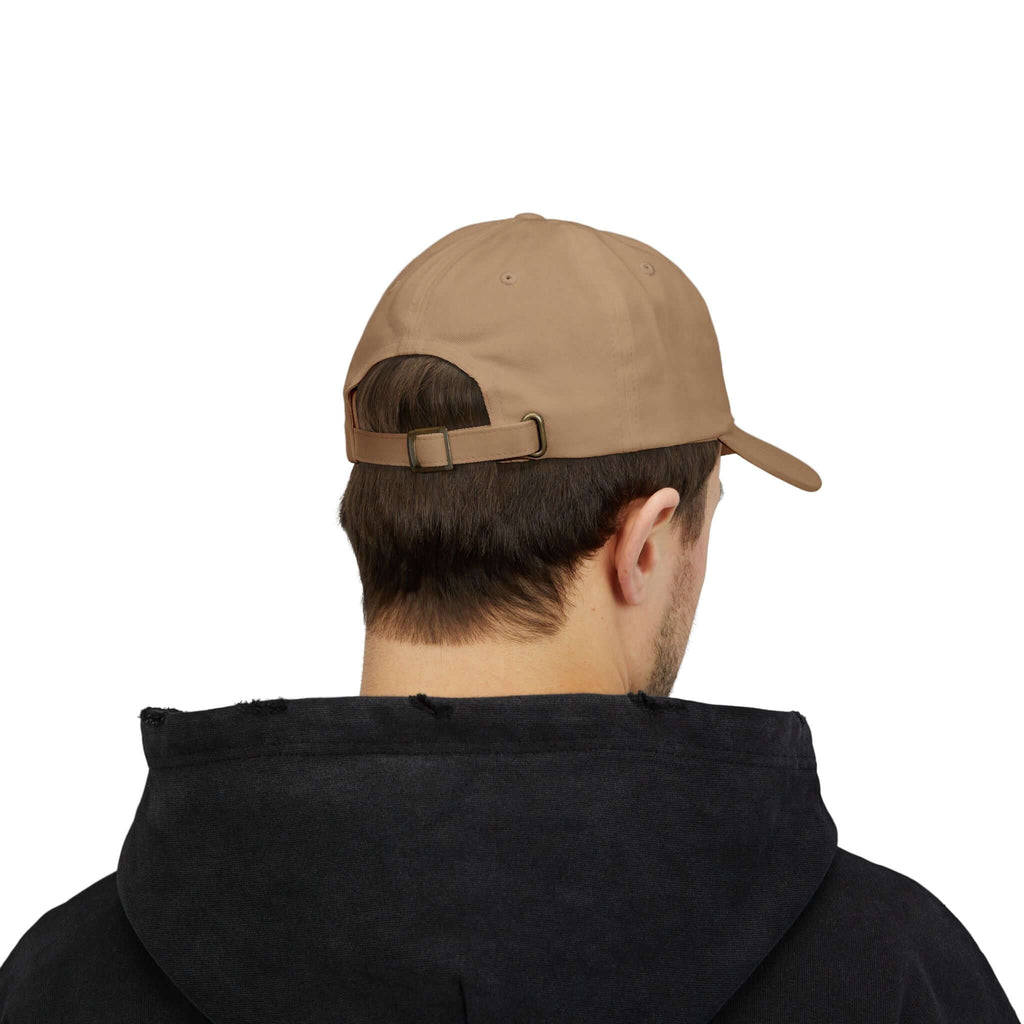 Back view of man wearing beige TeamSharkcage classic cap, highlighting adjustable strap and relaxed fit.