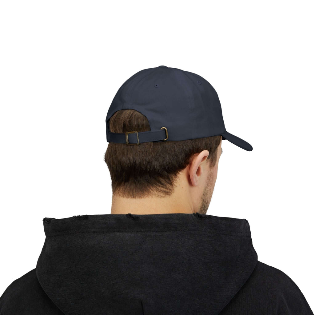 Side profile of man wearing beige TeamSharkcage classic cap, showing curved brim and structured fit, ideal for casual and sporty outfits.