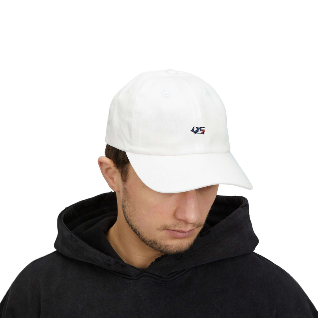 White classic cap worn by a man with a logo, perfect for casual summer wear and everyday style.